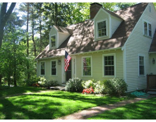 11 White Road Wayland, MA 01778 - Photo 1 of 18 a front view of a house with a yard