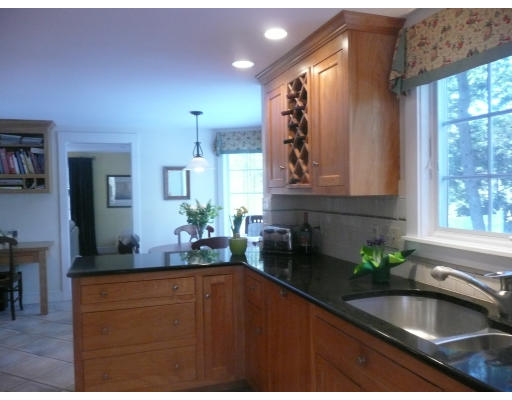 11 White Road Wayland, MA 01778 - Photo 15 of 18 a kitchen with a sink and large mirror