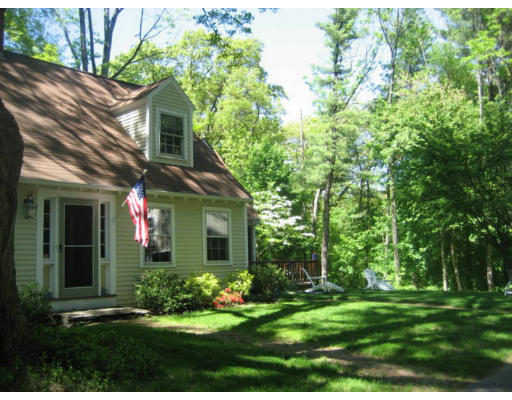 11 White Road Wayland, MA 01778 - Photo 17 of 18 a front view of a house with a yard and trees