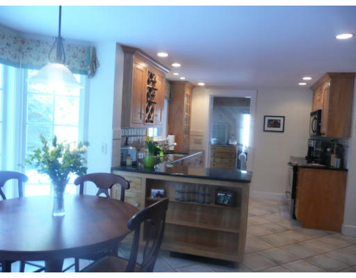 11 White Road Wayland, MA 01778 - Photo 5 of 18 a kitchen with a table and chairs in it