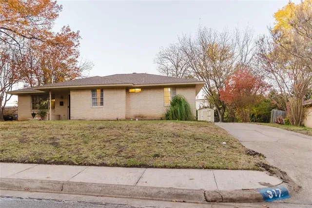 a dining room with furniture and a window