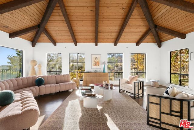 a room with blue walls and a potted plant