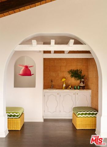 a bathroom with a sink and mirror