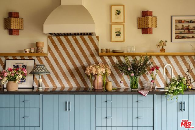 a front view of a house with a yard and a garage
