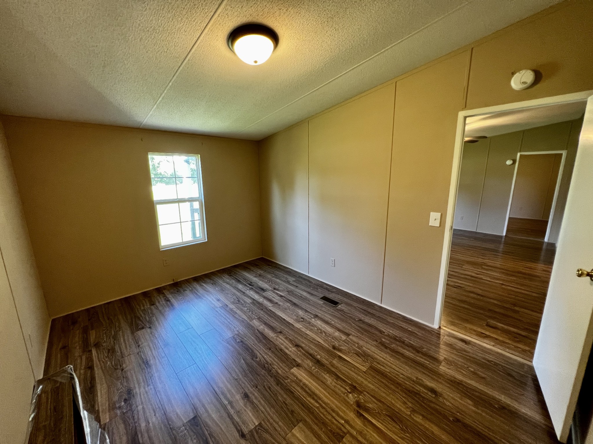 2979 Quarry Road Mount Juliet, TN 37122 - Photo 16 of 23 wooden floor in an empty room with a window