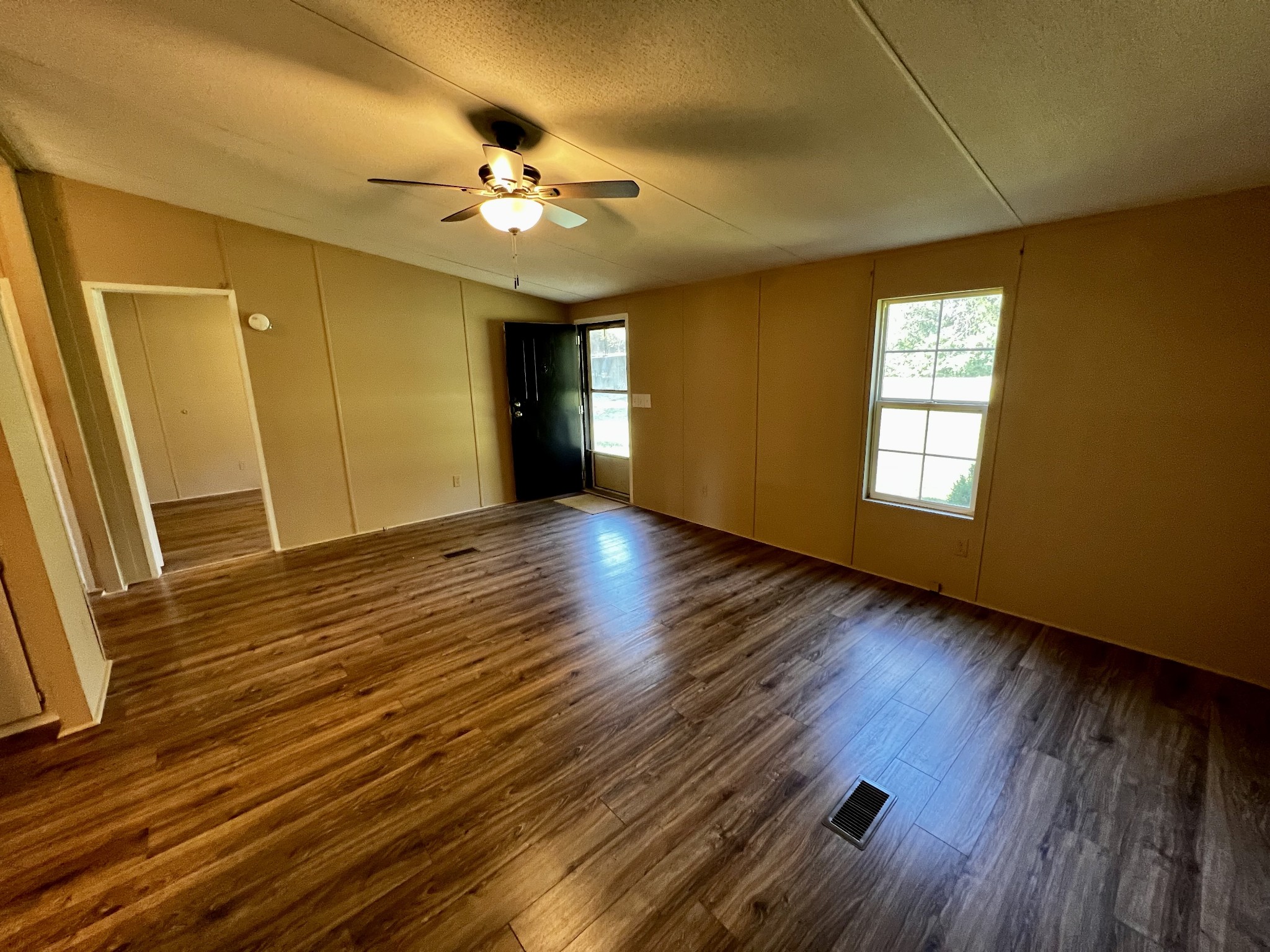 2979 Quarry Road Mount Juliet, TN 37122 - Photo 3 of 23 a view of an empty room with wooden floor and a window