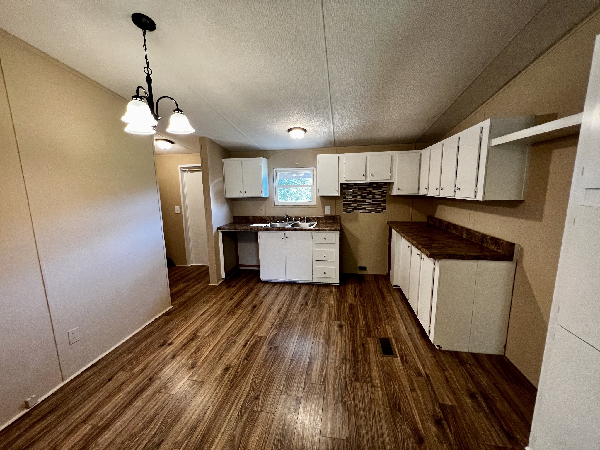 2979 Quarry Road Mount Juliet, TN 37122 - Photo 6 of 23 a kitchen with a sink stainless steel appliances a counter space and cabinets