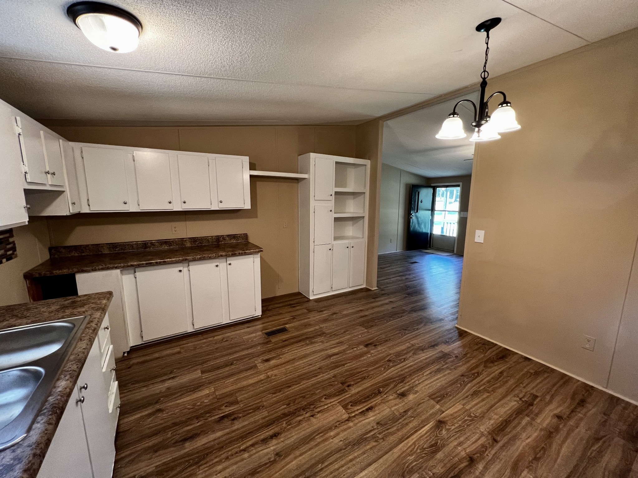 2979 Quarry Road Mount Juliet, TN 37122 - Photo 7 of 23 a kitchen with granite countertop a stove cabinets and wooden floor