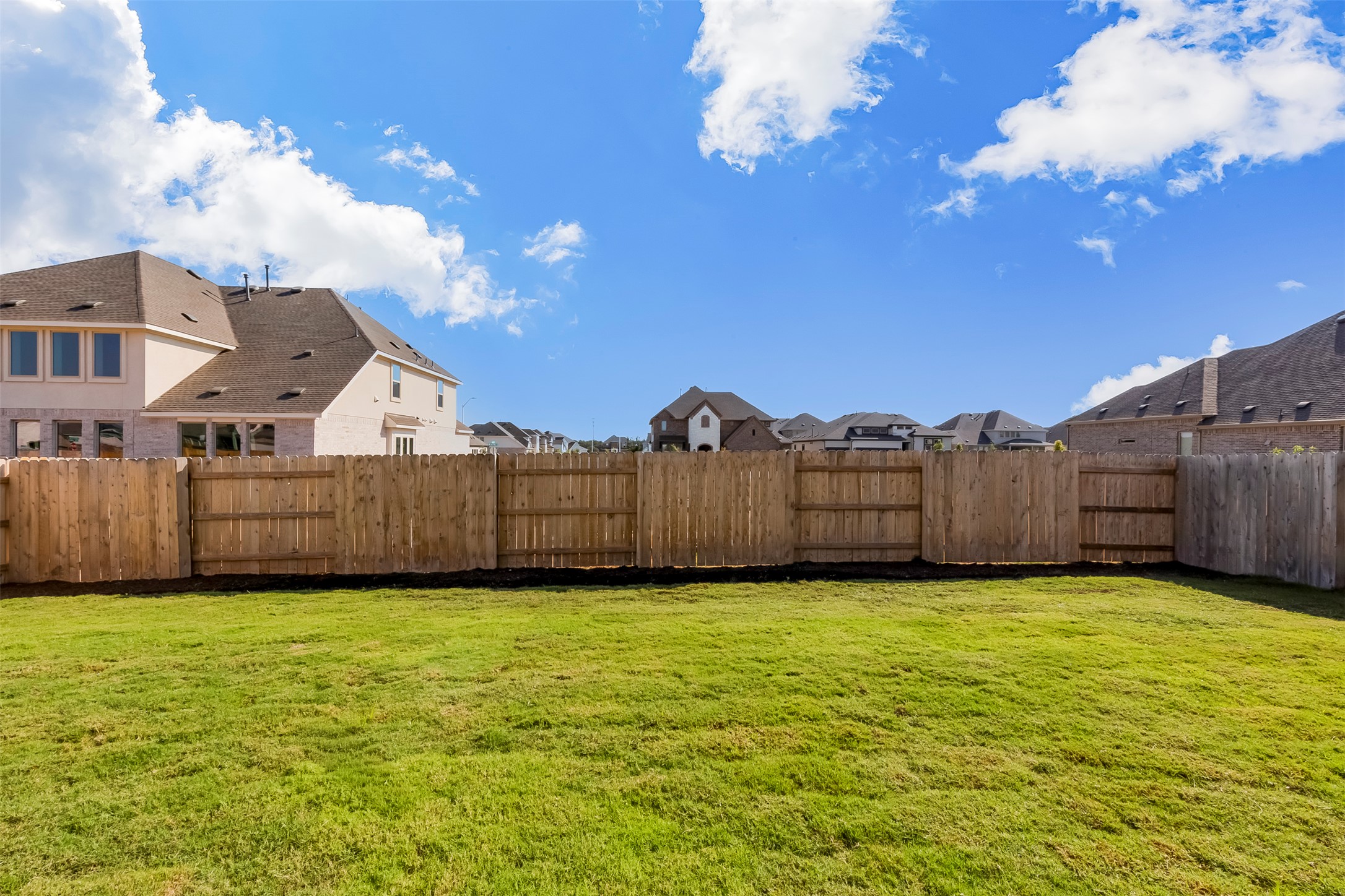 920 Old Gdn Road Leander, TX 78641 - Photo 37 of 39 Fenced backyard featuring a residential view