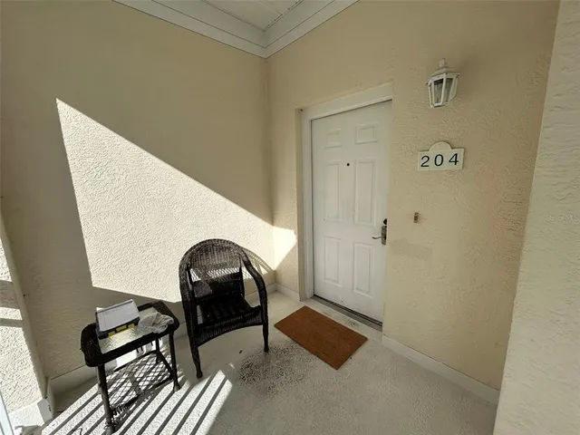 a view of a livingroom with furniture and front door