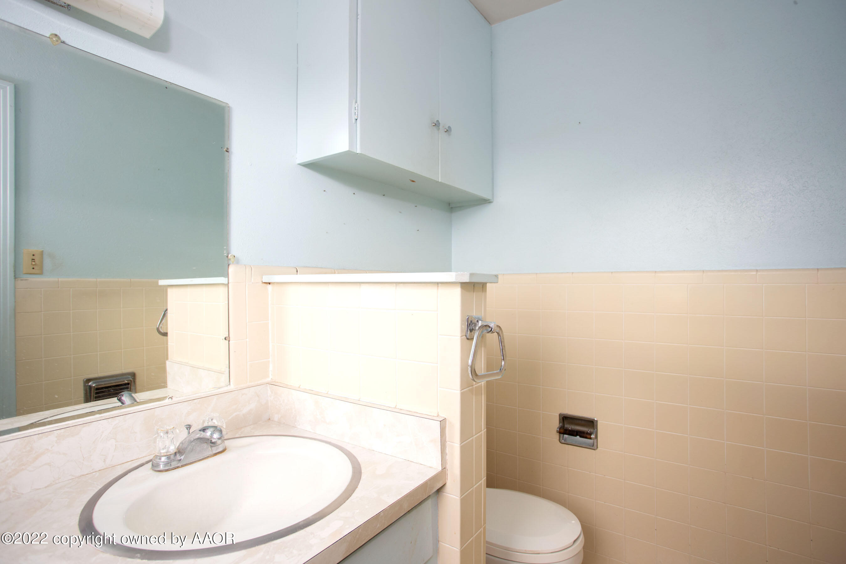 4819 Arden Road Amarillo, TX 79110 - Photo 21 of 33 a bathroom with a sink and a mirror