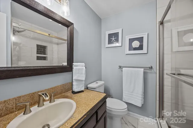 a bedroom with a bed and a chair