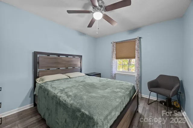 a bedroom with bed and a window