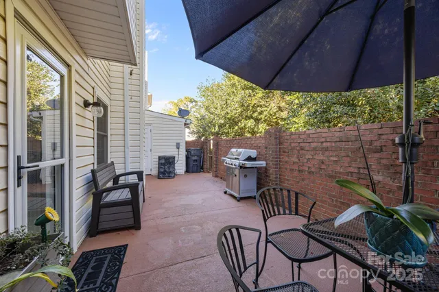 a view of a brick house with many windows