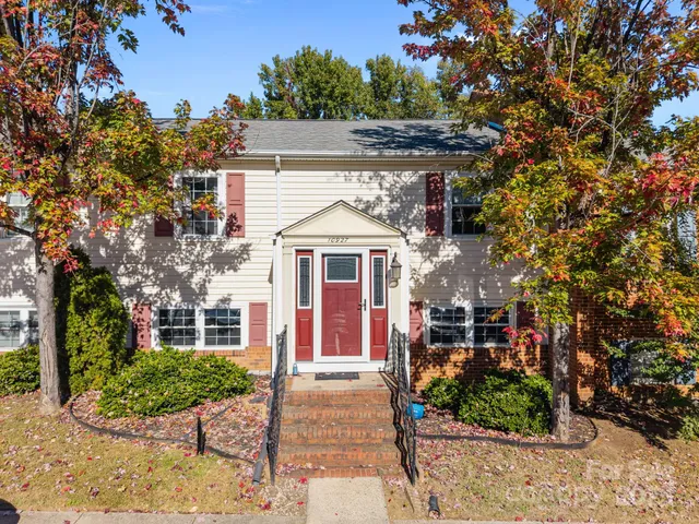 an aerial view of residential building and parking space