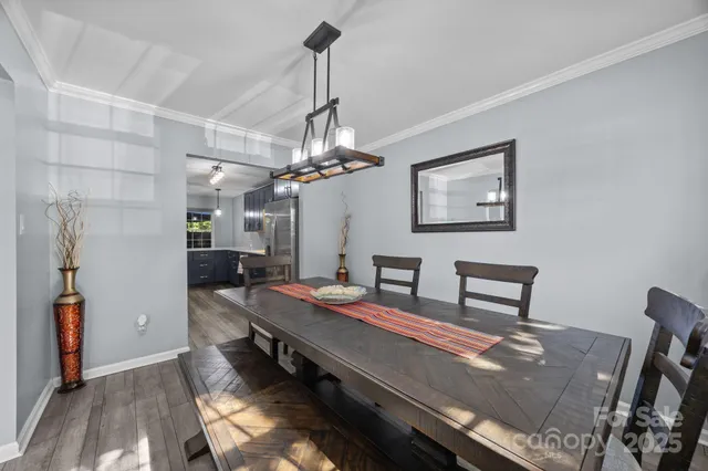 a reading room with furniture and a chandelier