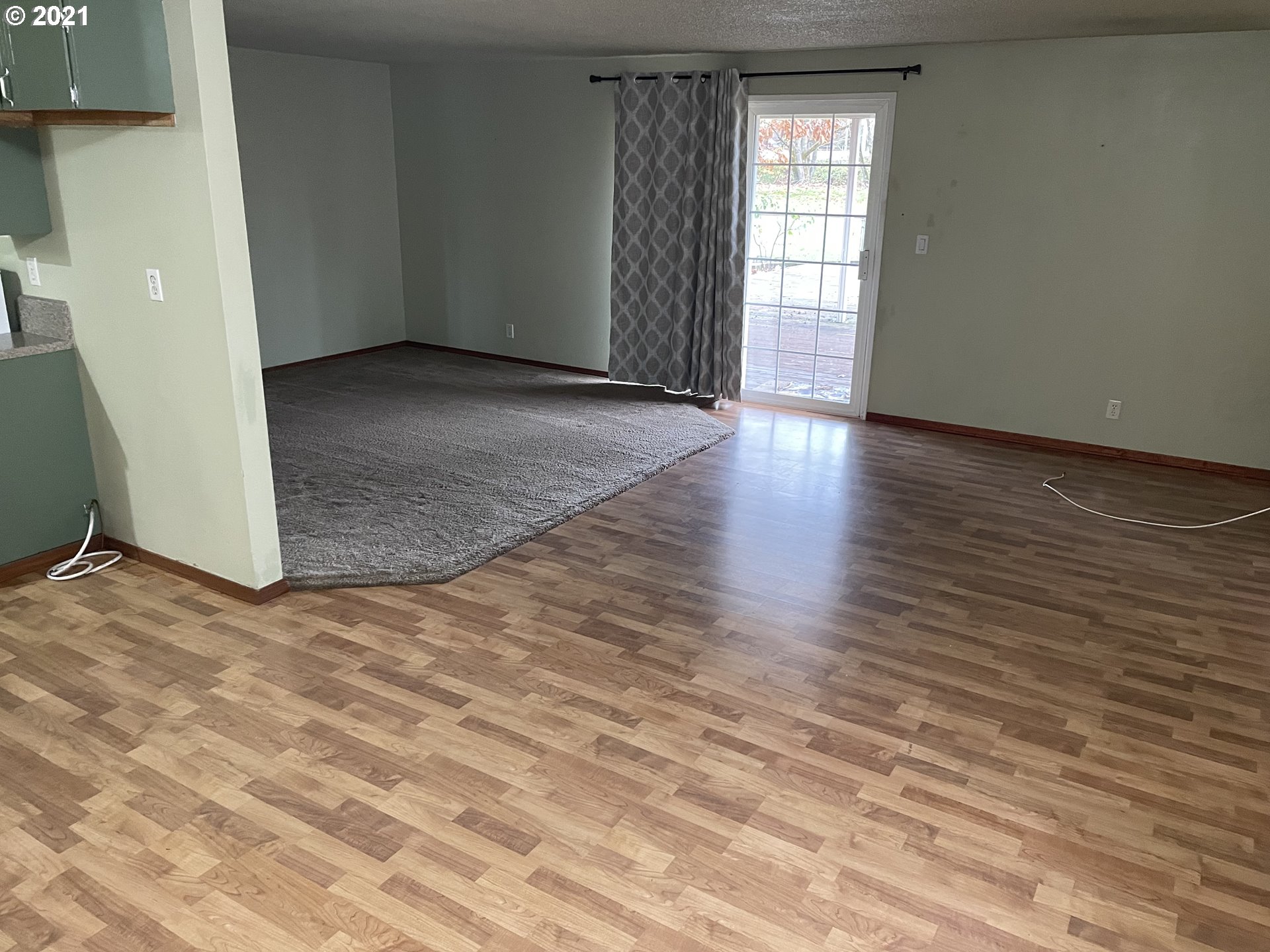 1286 Kenray Loop Springfield, OR 97477 - Photo 4 of 27 an empty room with wooden floor and windows