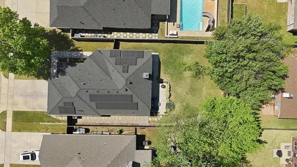 an aerial view of a house with swimming pool