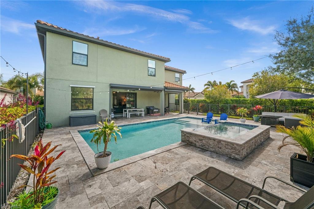 4754 Abaca Circle Naples, FL 34119 - Photo 39 of 46 a view of house with patio outdoor seating