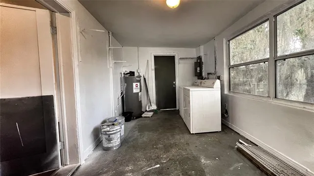 a room with a refrigerator and washer