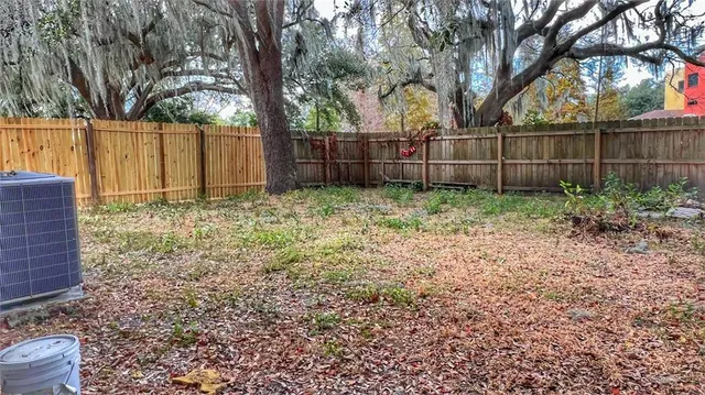 a backyard of a house with lots of green space