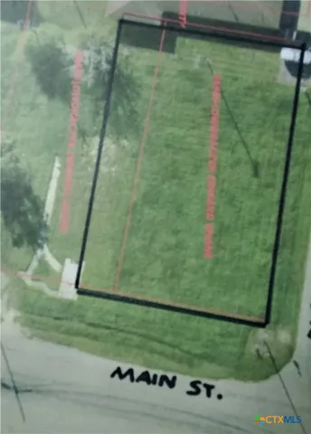 a view of a field with an trees