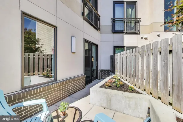 a view of a balcony with furniture