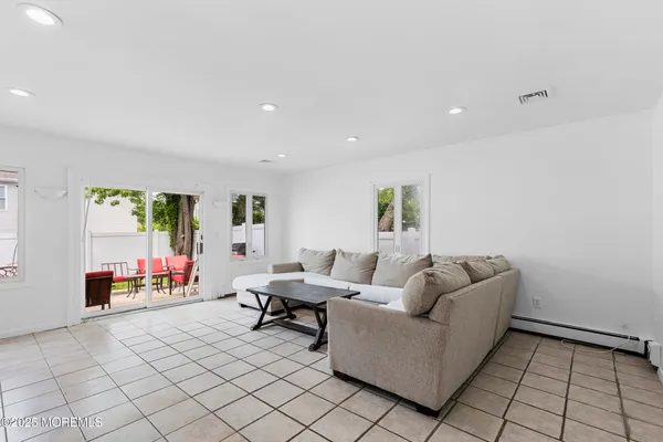 a living room with furniture and a table