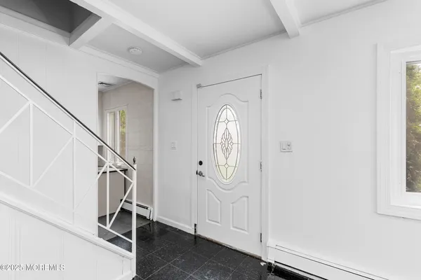 a view of a livingroom with stairs and stairs