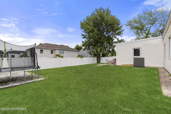 a view of a backyard with a garden and plants