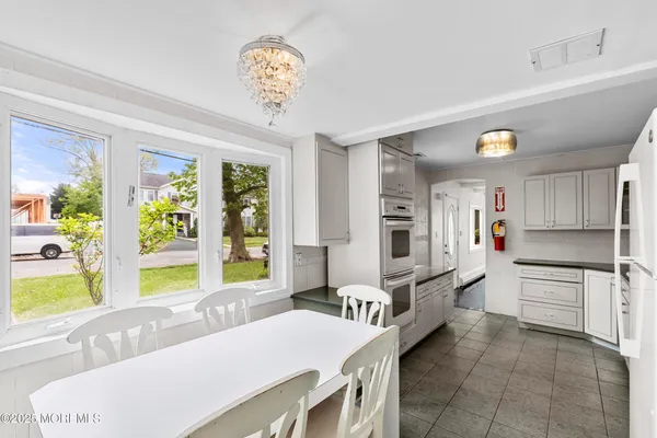 a living room with kitchen island furniture and a large window
