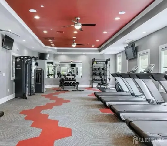 a view of a room with lots of gym equipment