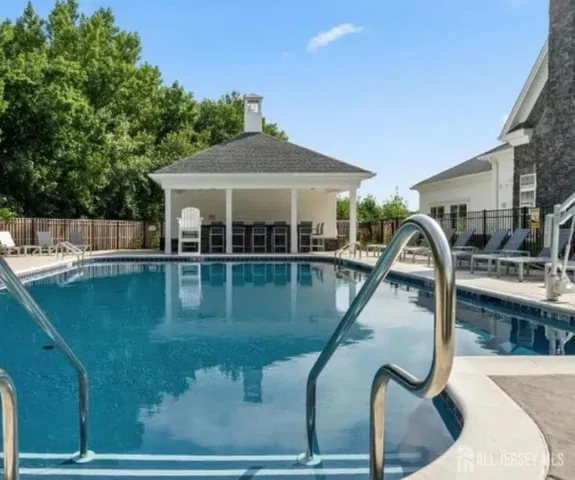 a view of a swimming pool with a patio