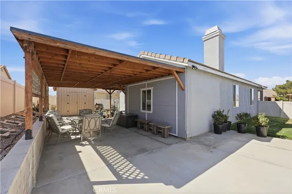 a patio with table and chairs