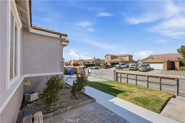 a view of a terrace with wooden fence