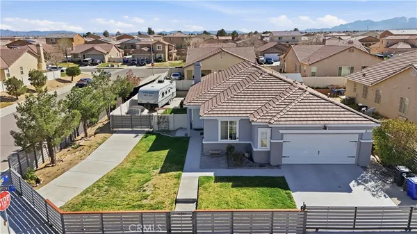 an aerial view of a house with swimming pool