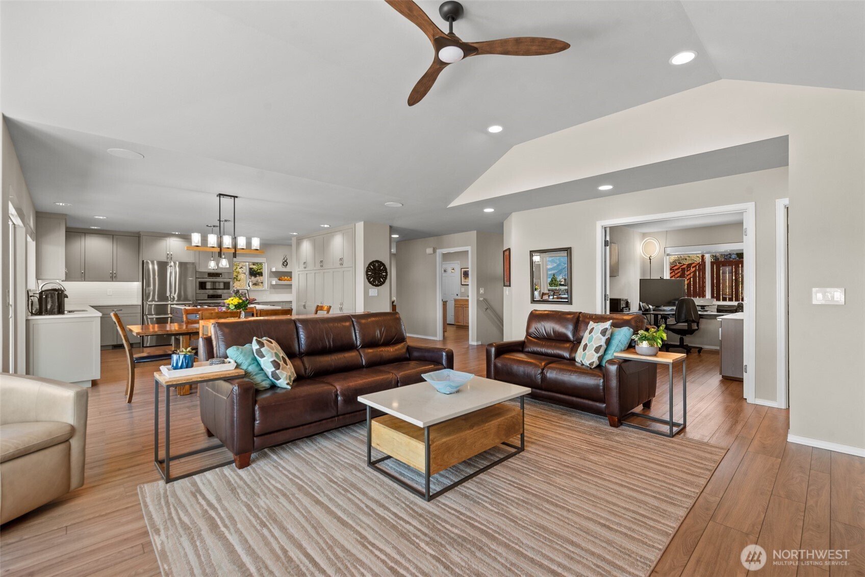 204 Stehekin Way Chelan, WA 98816 - Photo 11 of 40 a living room with furniture or dining table and a chandelier