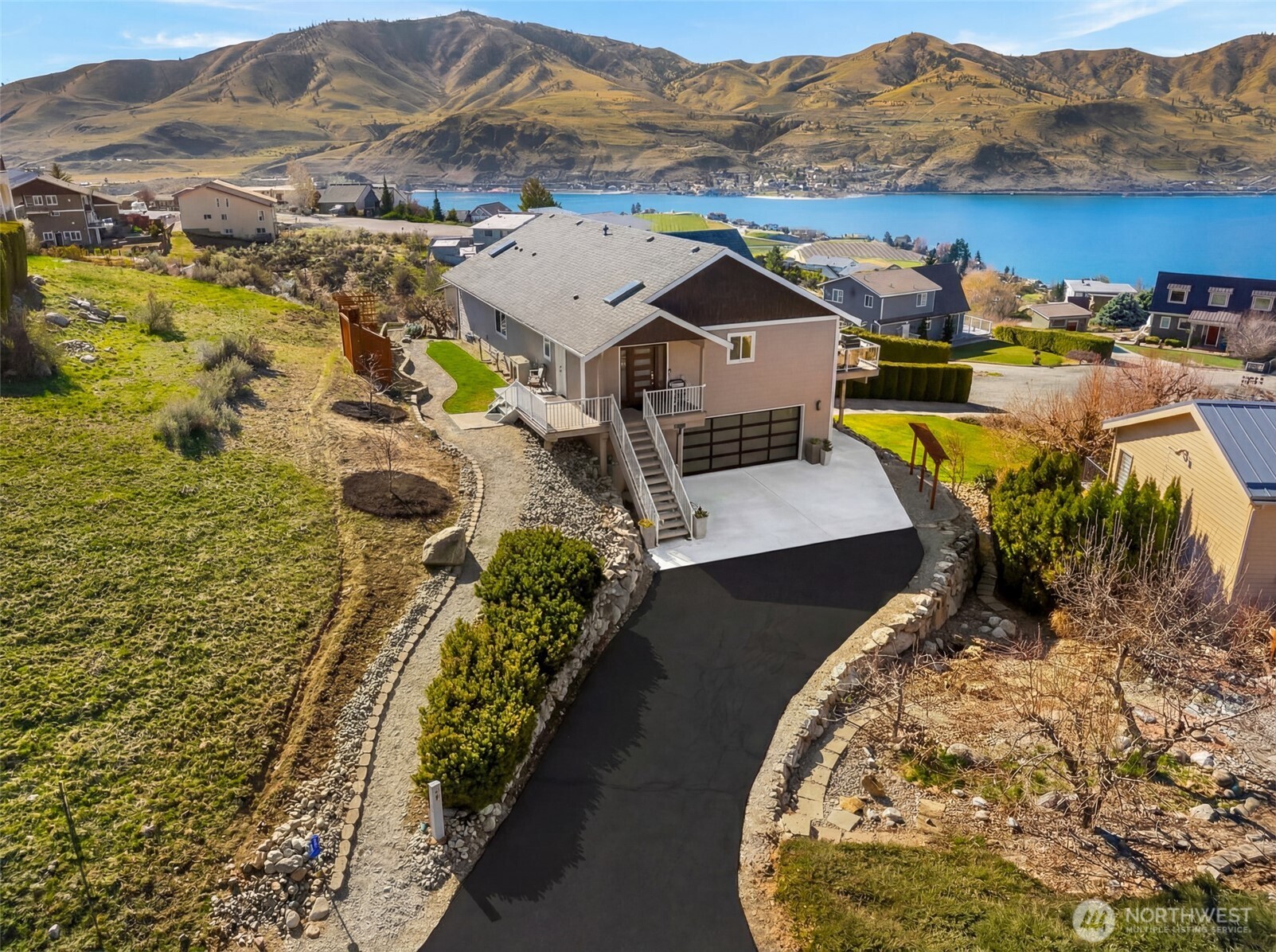 204 Stehekin Way Chelan, WA 98816 - Photo 15 of 40 a view of a swimming pool with a lake view