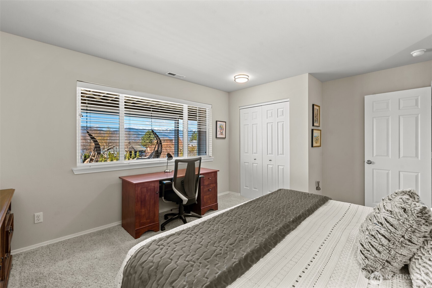 204 Stehekin Way Chelan, WA 98816 - Photo 24 of 40 a bedroom with a bed and a window