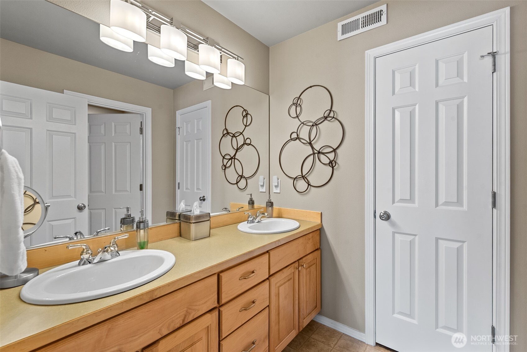 204 Stehekin Way Chelan, WA 98816 - Photo 26 of 40 a bathroom with double vanity sinks and a mirror