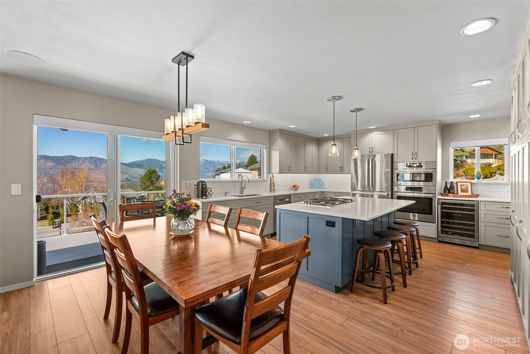 204 Stehekin Way Chelan, WA 98816 - Photo 4 of 40 a dining table with chairs and wooden floor