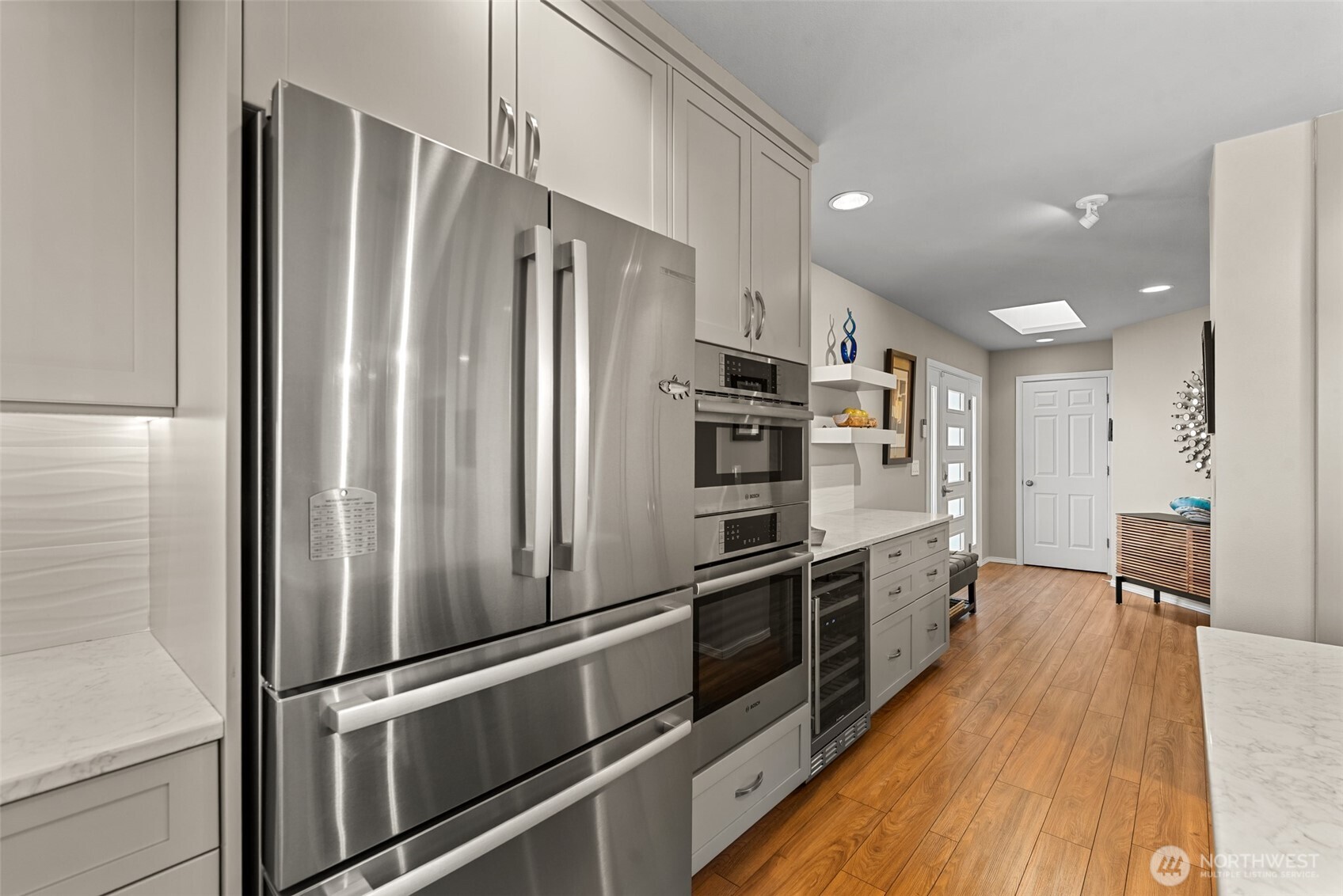 204 Stehekin Way Chelan, WA 98816 - Photo 6 of 40 a kitchen with stainless steel appliances a refrigerator and a stove top oven