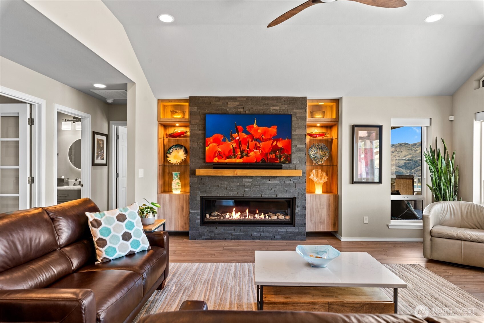 204 Stehekin Way Chelan, WA 98816 - Photo 10 of 40 a living room with furniture and a fireplace