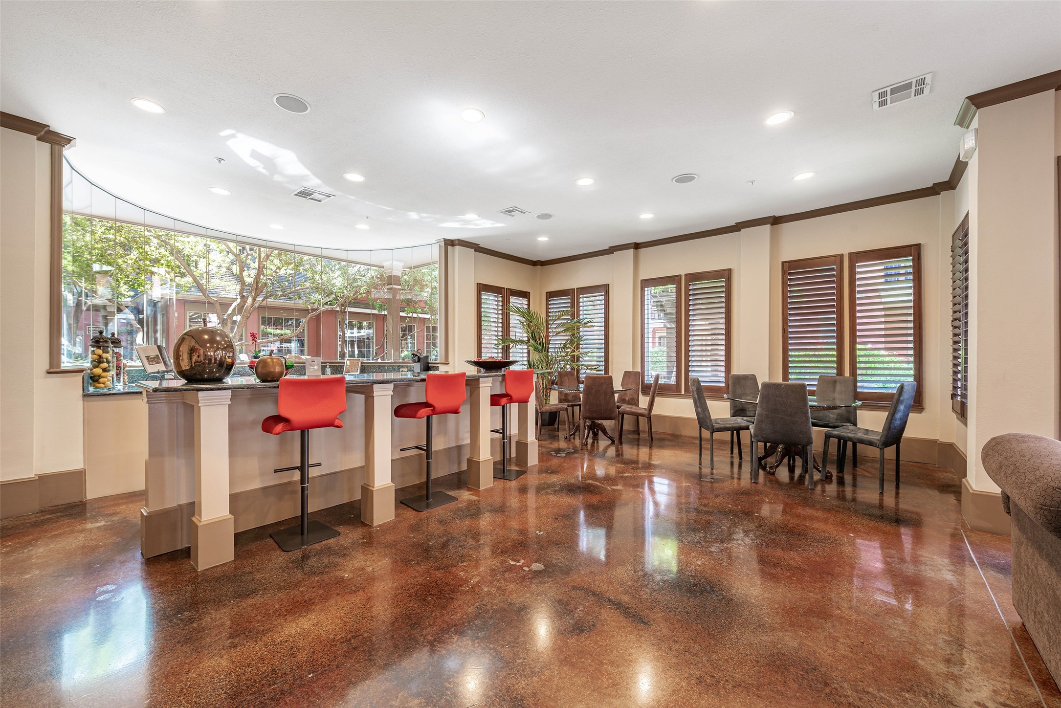 2400 McCue Road, Unit 260 Houston, TX 77056 - Photo 27 of 41 a room with lots of tables a large window and chairs