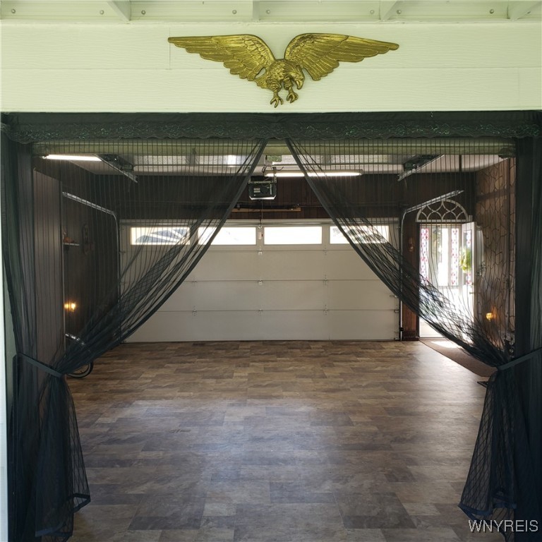 6717 Errick Road Wheatfield, NY 14120 - Photo 37 of 50 Rear door of the garage opens into the enclosed su