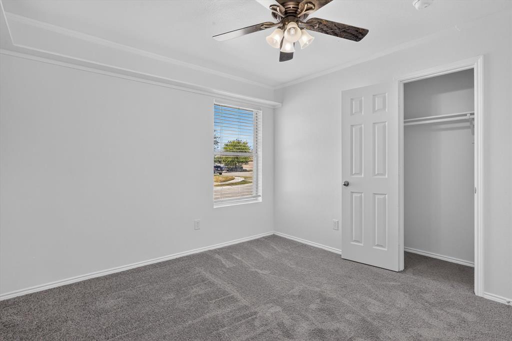 12933 Azure Heights Place Rhome, TX 76078 - Photo 22 of 37 Plush gray carpeting, white painted walls, and a multi-paneled door