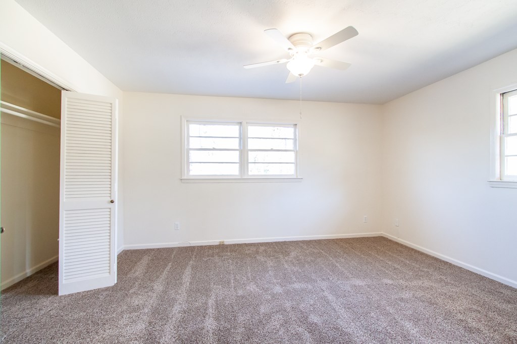 4315 Macon Road Columbus, GA 31907 - Photo 13 of 37 wooden floor in an empty room with a window