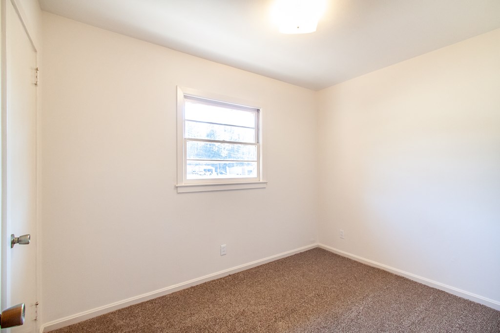 4315 Macon Road Columbus, GA 31907 - Photo 17 of 37 an empty room with a window