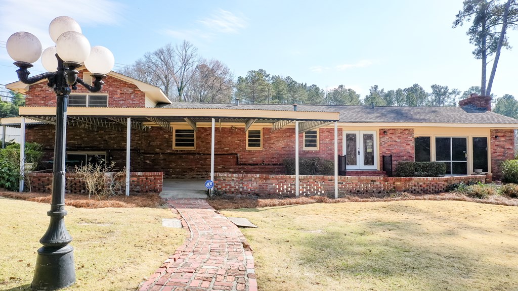 4315 Macon Road Columbus, GA 31907 - Photo 28 of 37 a view of large house with a yard