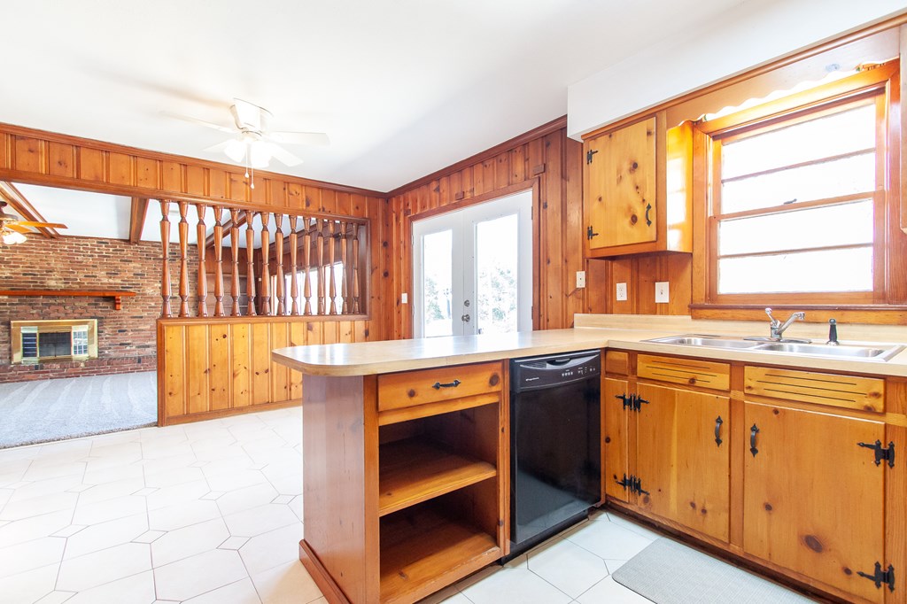 4315 Macon Road Columbus, GA 31907 - Photo 8 of 37 a kitchen with a sink stove and cabinets